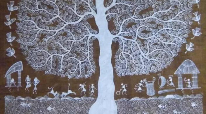 Image: Warli art depicting tree foliage and people doing different things below the shade. Photograph source: Authors